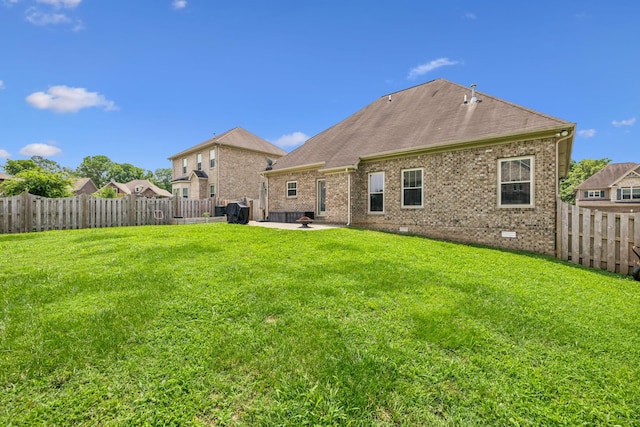 1005 Rudder Dr, Spring Hill, TN 37174 - back of house featuring a fenced backyard, a patio area, crawl space, and brick siding