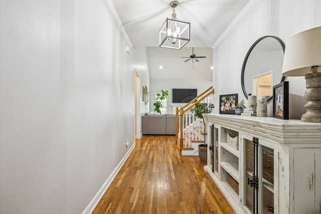 1005 Rudder Dr, Spring Hill, TN 37174 - hall with wood finished floors, stairway, crown molding, and a chandelier