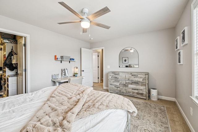 1005 Rudder Dr, Spring Hill, TN 37174 - bedroom featuring light carpet, a walk in closet, a ceiling fan, and a closet