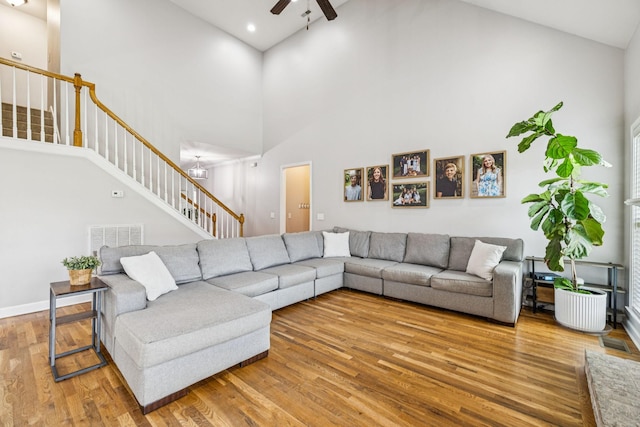 1005 Rudder Dr, Spring Hill, TN 37174 - living room with high vaulted ceiling, a ceiling fan, stairs, wood finished floors, and recessed lighting