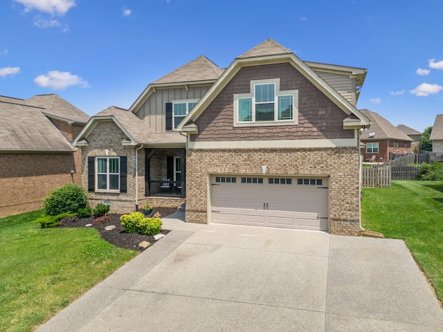 1005 Rudder Dr, Spring Hill, TN 37174 - view of front of house featuring board and batten siding, driveway, a garage, and brick siding