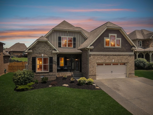 1005 Rudder Dr, Spring Hill, TN 37174 - view of front facade featuring covered porch, board and batten siding, concrete driveway, an attached garage, and brick siding