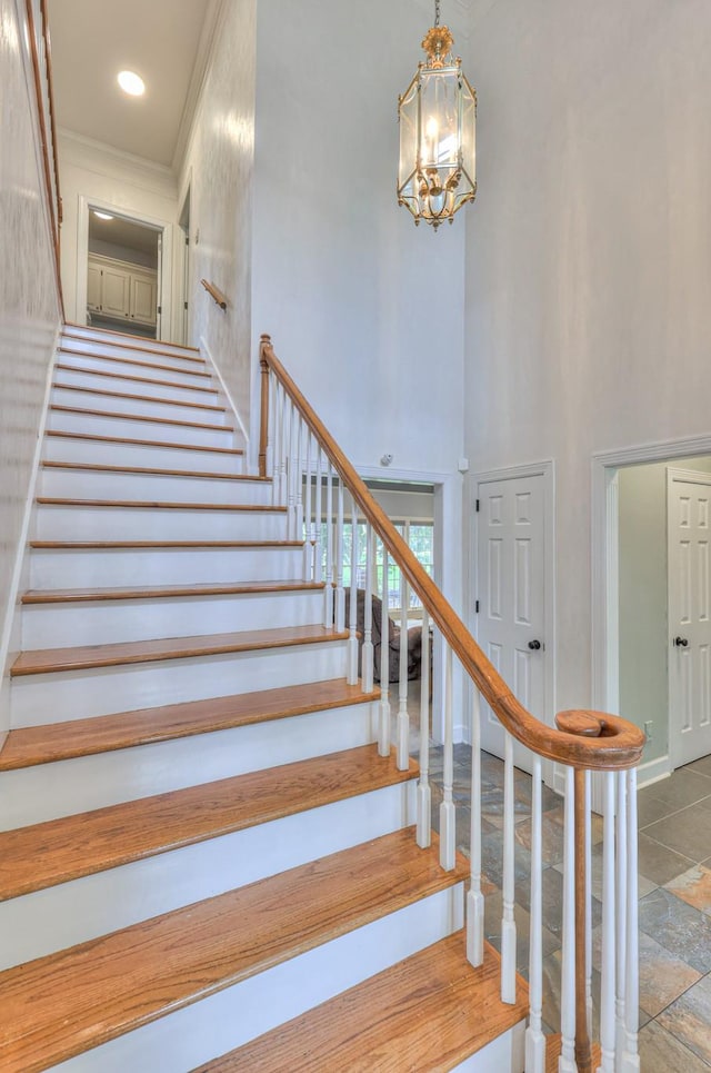 101 Spring Creek Trl, Hendersonville, TN 37075 - stairway featuring a towering ceiling, a chandelier, and crown molding