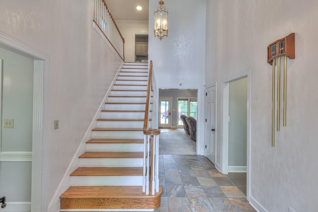 101 Spring Creek Trl, Hendersonville, TN 37075 - staircase with stone tile flooring, a towering ceiling, recessed lighting, and a chandelier