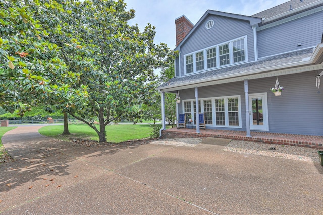 101 Spring Creek Trl, Hendersonville, TN 37075 - view of home's exterior featuring a chimney, a yard, and a patio area