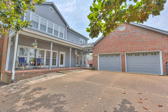 101 Spring Creek Trl, Hendersonville, TN 37075 - traditional-style house featuring driveway, covered porch, brick siding, and an attached garage