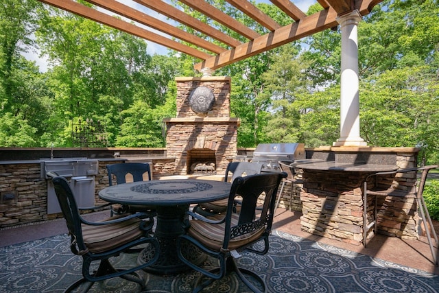 101 Oak Dr, Waverly, TN 37185 - view of patio / terrace featuring area for grilling, a pergola, outdoor dining area, and an outdoor stone fireplace