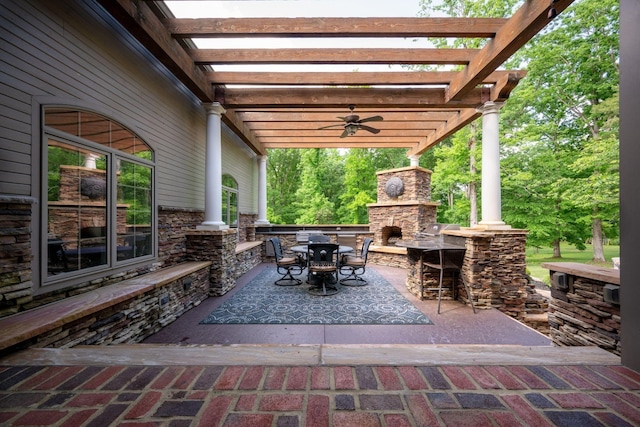 101 Oak Dr, Waverly, TN 37185 - view of patio / terrace with an outdoor stone fireplace, ceiling fan, outdoor dining space, a pergola, and a grill