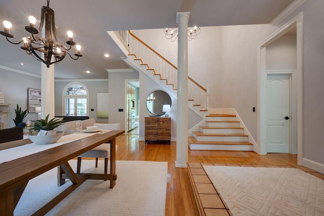 101 Oak Dr, Waverly, TN 37185 - entryway with stairway, a chandelier, light wood-style floors, ornamental molding, and recessed lighting