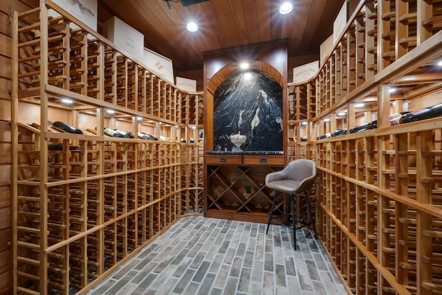 101 Oak Dr, Waverly, TN 37185 - wine area with brick flooring, wooden ceiling, and recessed lighting