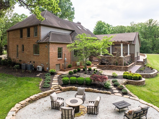 101 Oak Dr, Waverly, TN 37185 - rear view of property with a fire pit, a patio area, a lawn, and a shingled roof