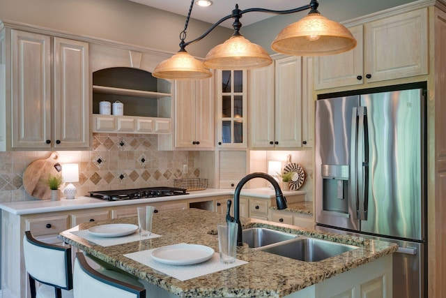 101 Oak Dr, Waverly, TN 37185 - kitchen featuring stainless steel fridge, black gas cooktop, decorative backsplash, glass insert cabinets, and pendant lighting