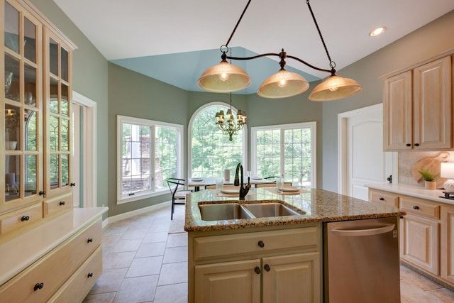 101 Oak Dr, Waverly, TN 37185 - kitchen with stainless steel dishwasher, light brown cabinetry, a center island with sink, lofted ceiling, and light stone countertops