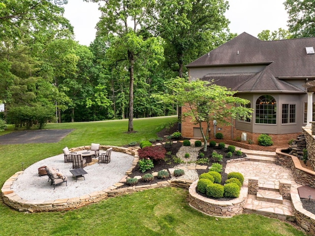 101 Oak Dr, Waverly, TN 37185 - view of grassy yard featuring a patio and an outdoor fire pit