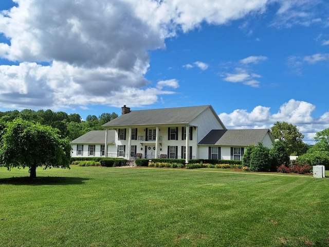 2600 Clanton Rd, Lawrenceburg, TN 38464 - view of front of property featuring a chimney and a front yard