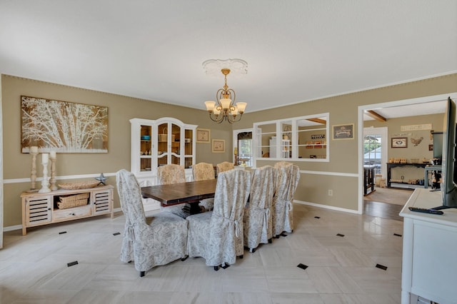 2600 Clanton Rd, Lawrenceburg, TN 38464 - dining space featuring a chandelier and baseboards