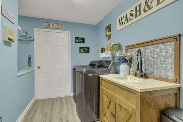 2600 Clanton Rd, Lawrenceburg, TN 38464 - washroom featuring washer and clothes dryer and light wood-style floors