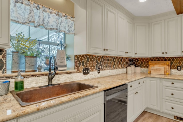 2600 Clanton Rd, Lawrenceburg, TN 38464 - kitchen with stainless steel dishwasher, white cabinets, and light stone counters