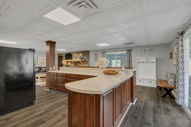 2600 Clanton Rd, Lawrenceburg, TN 38464 - kitchen featuring freestanding refrigerator, light countertops, dark wood-type flooring, and healthy amount of natural light