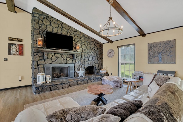 2600 Clanton Rd, Lawrenceburg, TN 38464 - living room featuring a stone fireplace, wood finished floors, and a chandelier
