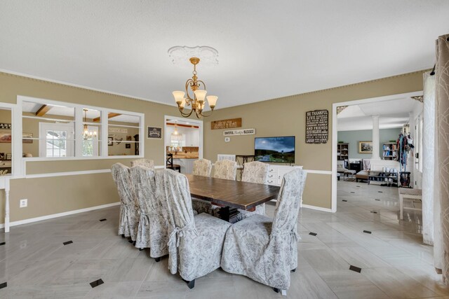 2600 Clanton Rd, Lawrenceburg, TN 38464 - dining area featuring a chandelier and light tile patterned flooring