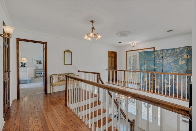 2600 Clanton Rd, Lawrenceburg, TN 38464 - hall with an upstairs landing, hardwood / wood-style flooring, a chandelier, and ornamental molding