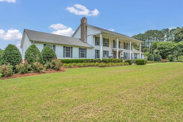2600 Clanton Rd, Lawrenceburg, TN 38464 - view of front facade with a chimney and a front lawn