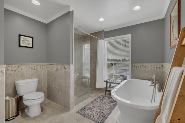 2600 Clanton Rd, Lawrenceburg, TN 38464 - full bath featuring tile walls, a stall shower, a soaking tub, crown molding, and tile patterned floors