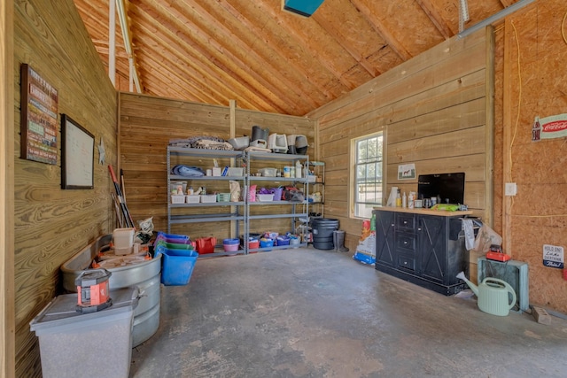2600 Clanton Rd, Lawrenceburg, TN 38464 - miscellaneous room with lofted ceiling, wooden walls, and unfinished concrete floors