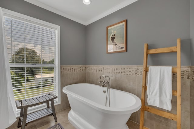 2600 Clanton Rd, Lawrenceburg, TN 38464 - bathroom with tile walls, a soaking tub, tile patterned flooring, wainscoting, and crown molding