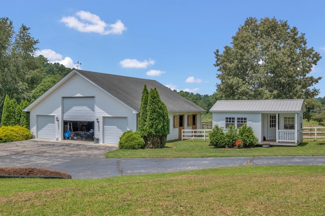 2600 Clanton Rd, Lawrenceburg, TN 38464 - ranch-style house with an outbuilding and a detached garage