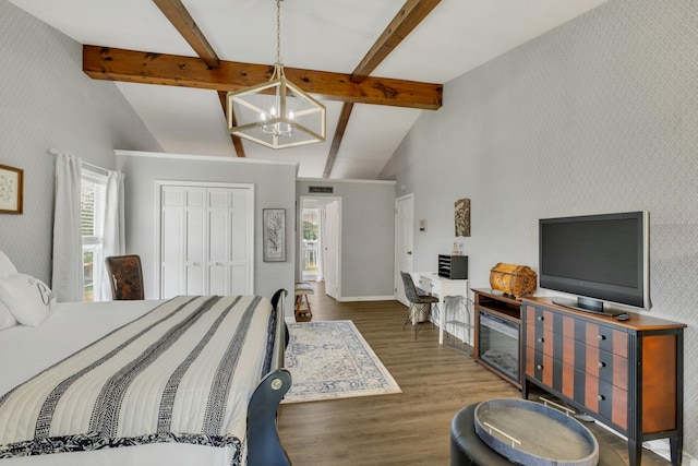 2600 Clanton Rd, Lawrenceburg, TN 38464 - bedroom featuring a chandelier, multiple windows, wood finished floors, wallpapered walls, and a closet