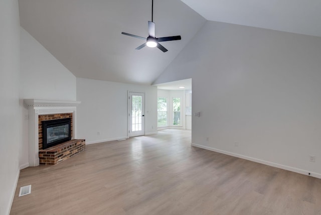1602 Annie Ln, Columbia, TN 38401 - unfurnished living room featuring high vaulted ceiling, a ceiling fan, a fireplace, and light wood-style flooring
