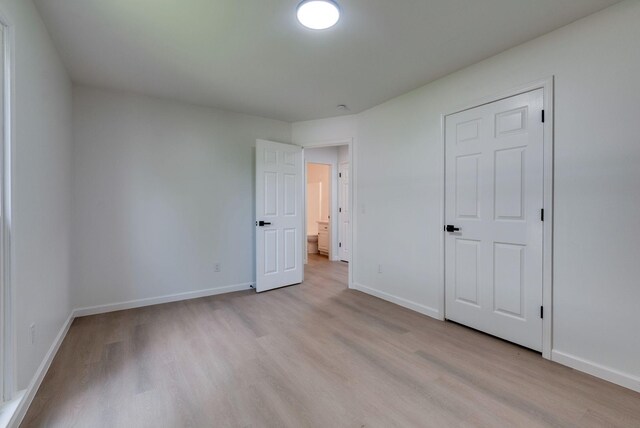 1602 Annie Ln, Columbia, TN 38401 - unfurnished bedroom with light wood-type flooring and baseboards