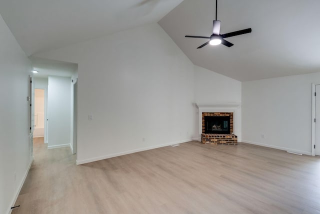 1602 Annie Ln, Columbia, TN 38401 - unfurnished living room featuring ceiling fan, light wood finished floors, a fireplace, and high vaulted ceiling