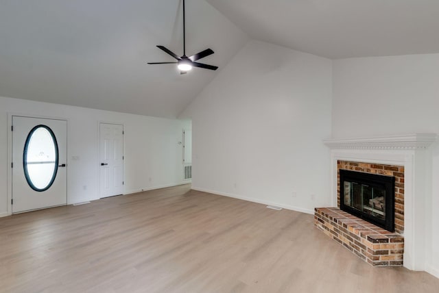 1602 Annie Ln, Columbia, TN 38401 - unfurnished living room featuring a ceiling fan, light wood-style flooring, a fireplace, and high vaulted ceiling