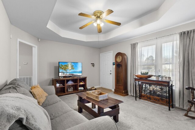739 Carmack Ct, Clarksville, TN 37042 - living room with a tray ceiling, light colored carpet, and a ceiling fan