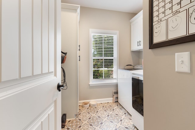 3215 Church St, Burns, TN 37029 - laundry area featuring separate washer and dryer, cabinet space, and light tile patterned floors