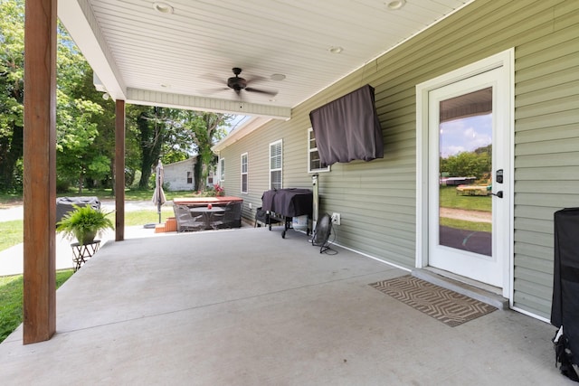3215 Church St, Burns, TN 37029 - view of patio featuring a ceiling fan and a grill