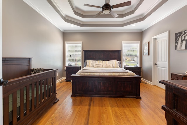 3215 Church St, Burns, TN 37029 - bedroom featuring light wood finished floors, a tray ceiling, ornamental molding, recessed lighting, and a ceiling fan
