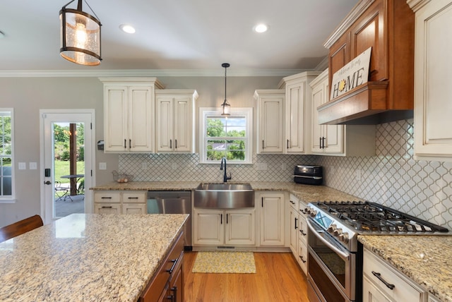 3215 Church St, Burns, TN 37029 - kitchen with appliances with stainless steel finishes, light wood-style floors, light stone countertops, ornamental molding, and tasteful backsplash