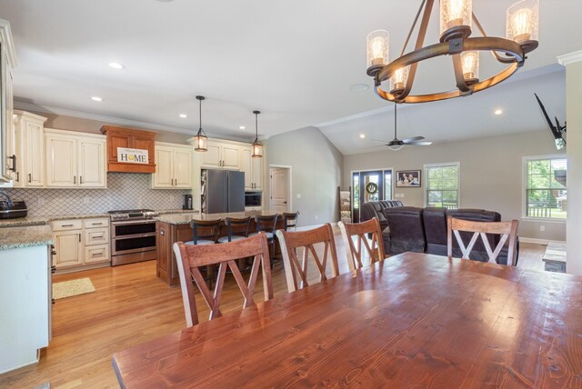3215 Church St, Burns, TN 37029 - dining space featuring light wood-style flooring, recessed lighting, vaulted ceiling, and a ceiling fan