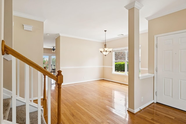 2025 Morrison Ave, Spring Hill, TN 37174 - entryway with ornamental molding, wood finished floors, a chandelier, and stairway