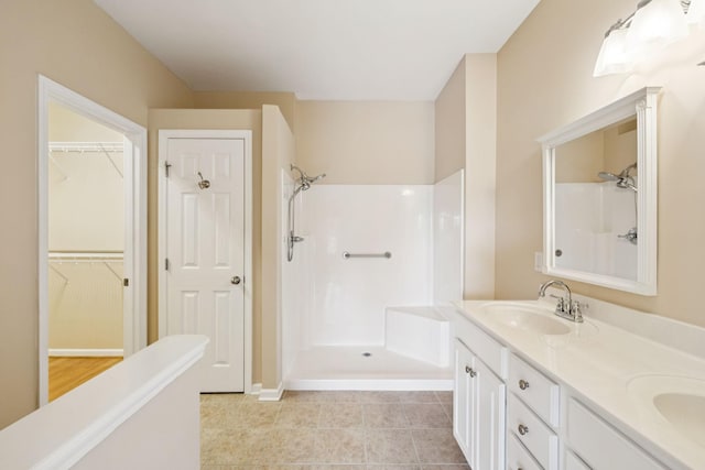 2025 Morrison Ave, Spring Hill, TN 37174 - full bathroom with a shower, double vanity, and a walk in closet