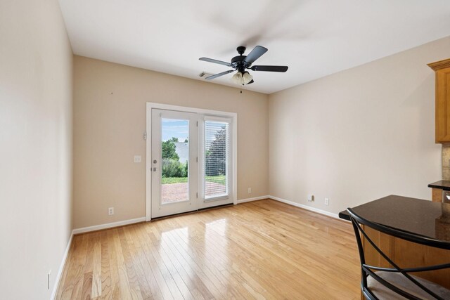 2025 Morrison Ave, Spring Hill, TN 37174 - unfurnished living room featuring light wood-style flooring and a ceiling fan