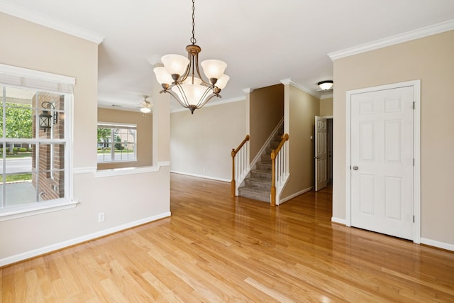 2025 Morrison Ave, Spring Hill, TN 37174 - unfurnished room featuring light wood-type flooring, a chandelier, stairs, ornamental molding, and a ceiling fan