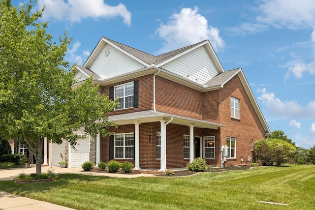 2025 Morrison Ave, Spring Hill, TN 37174 - traditional-style house featuring a front lawn, driveway, brick siding, and a garage