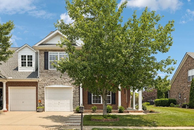 2025 Morrison Ave, Spring Hill, TN 37174 - view of property hidden behind natural elements with driveway, a front yard, an attached garage, stone siding, and brick siding