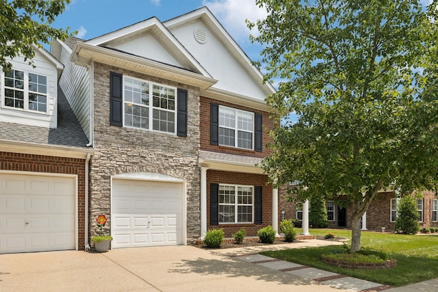 2025 Morrison Ave, Spring Hill, TN 37174 - view of front of home featuring concrete driveway, stone siding, a garage, a shingled roof, and a front yard
