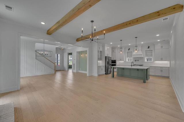 6060 Pasquo Rd, Nashville, TN 37221 - kitchen featuring stainless steel refrigerator with ice dispenser, a chandelier, light countertops, beam ceiling, and light wood finished floors